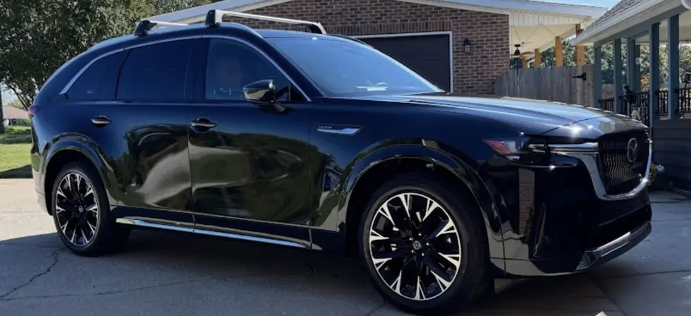 Glossy black SUV exterior after detailing