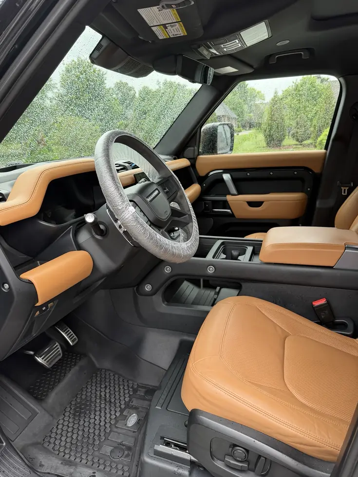 Clean tan and black vehicle interior after detailing